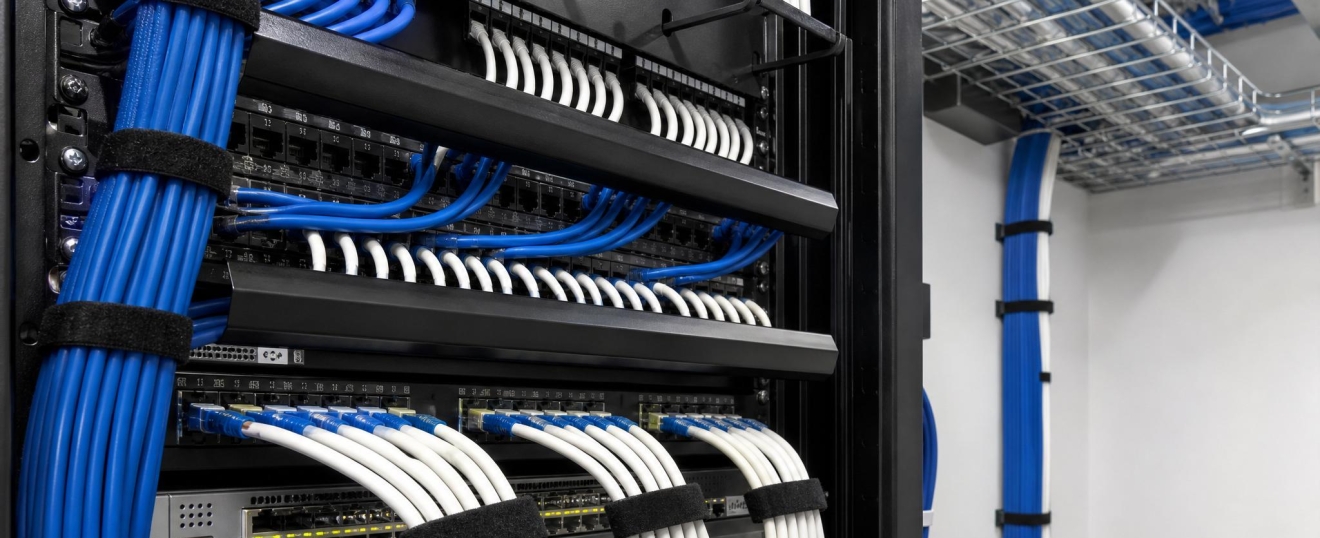 Professional network cabling installation for business WiFi, security cameras, and fiber networking in North Texas.