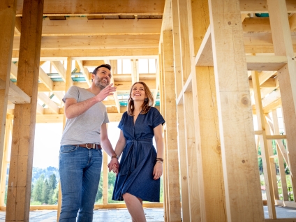 Happy Midlothian Homeowners walking through New Construction Home